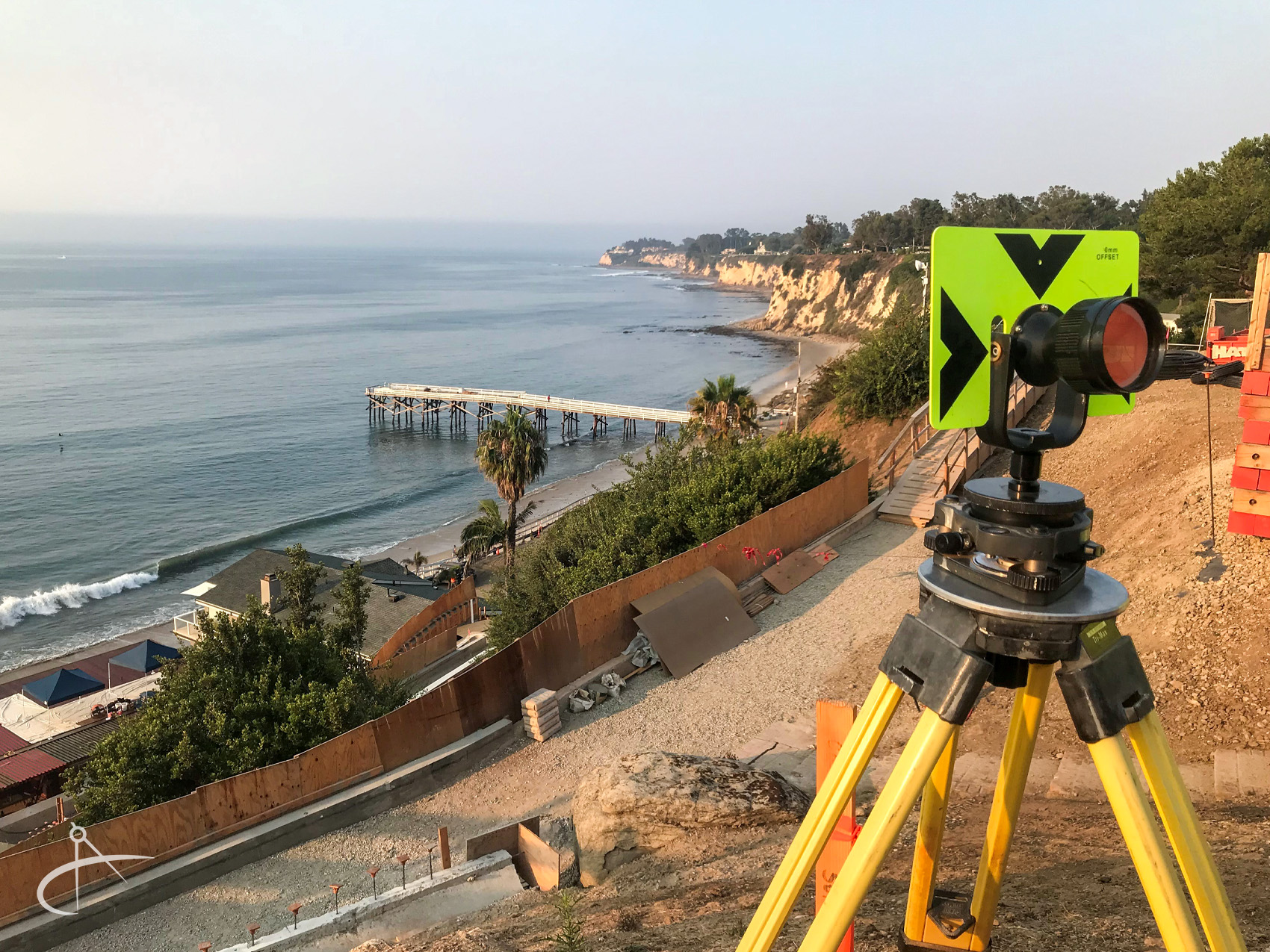 Back site prism setup on hill overlooking the ocean. 