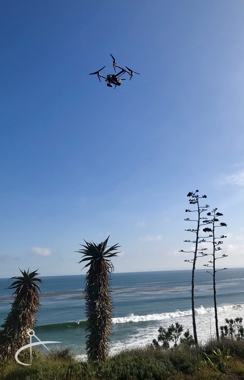 DJI Inspire2 drone flying over the beach.